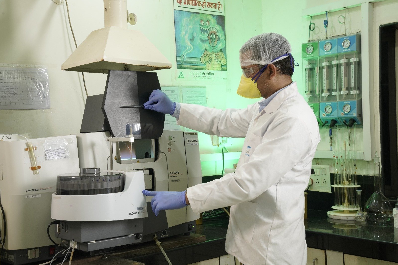 Environmental Laboratory Analysis SMS Envocare laboratory technician operating analytical testing equipment for environmental sample analysis.
